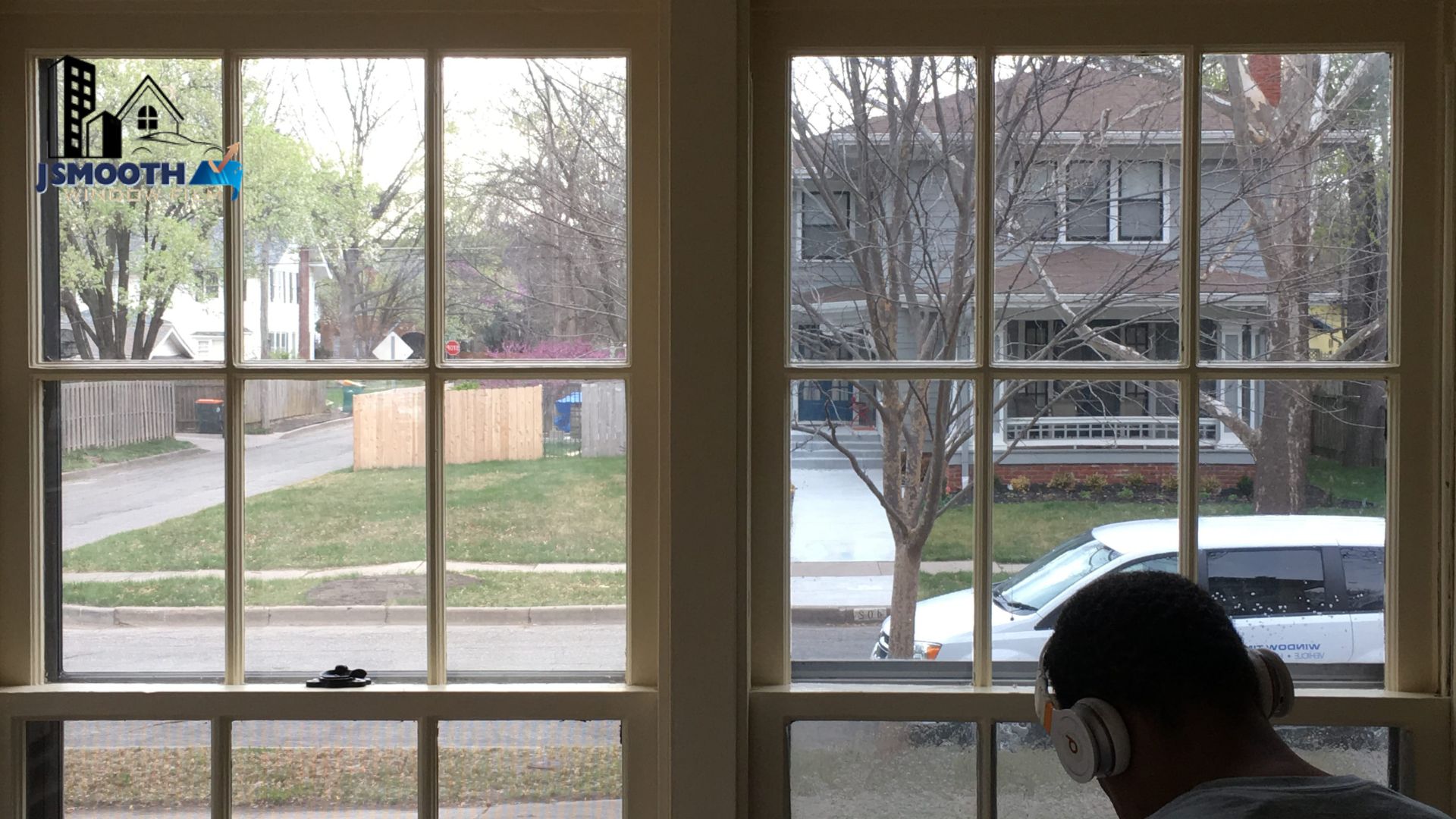 Home window tint installed on large residential windows improving privacy and reducing glare inside a living space